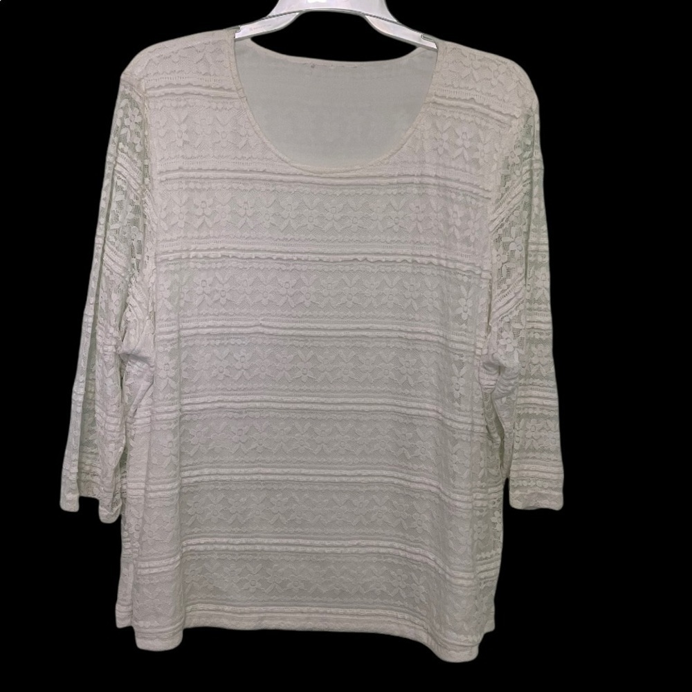 Very pretty, white lace top. Solid white shell underneath body. Arms just lace.